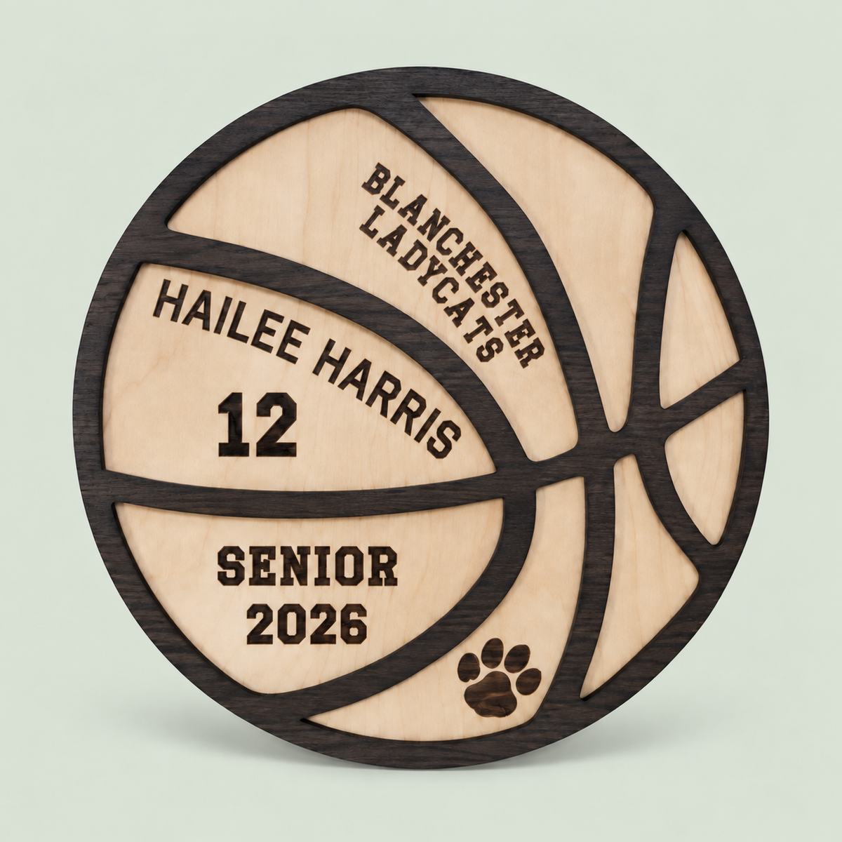 Personalized wooden basketball senior plaque with name and jersey number on a soft sage background