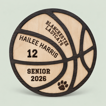 Personalized wooden basketball senior plaque with name and jersey number on a soft sage background