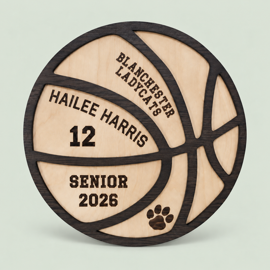Personalized wooden basketball senior plaque with name and jersey number on a soft sage background