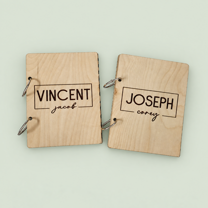 Two wooden greeting card keepers engraved with Vincent and Joseph, with silver binder rings.
