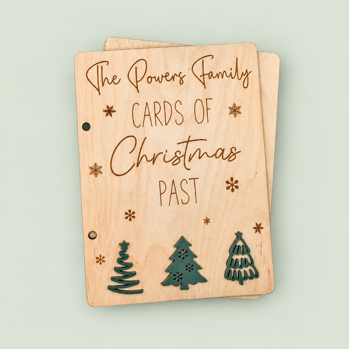 Wooden Cards of Christmas Past keeper personalized for the Powers family, with three green trees.
