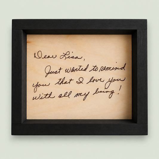 Black-framed wooden keepsake engraved with a handwritten Dear Lisa letter on soft sage.