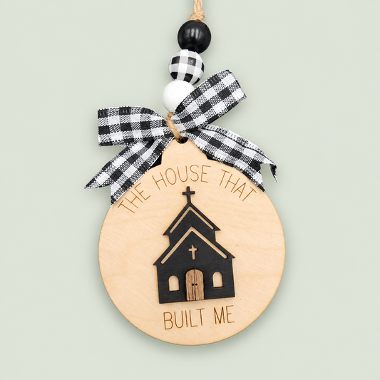 Wooden church ornament with The House That Built Me engraving, checked bow and beaded hanger.