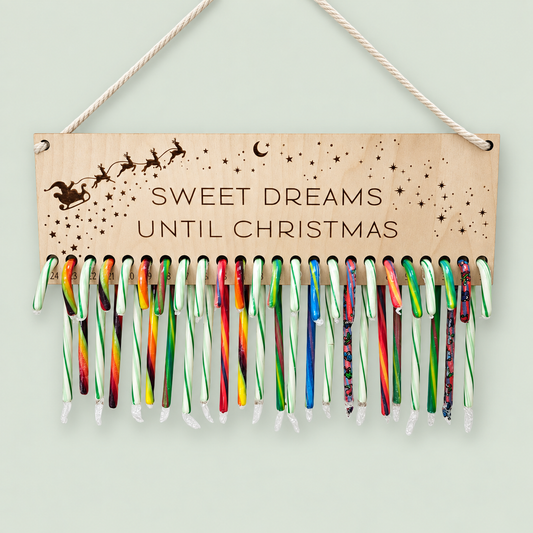 Wooden Sweet Dreams Until Christmas countdown sign displaying colorful candy canes.