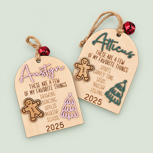 Personalized favorite things Christmas ornaments for Austyn and Atticus with gingerbread figures and trees on soft sage.