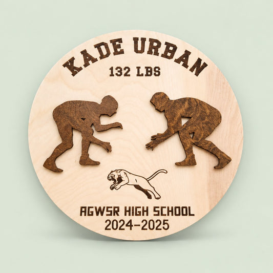 Personalized wooden wrestling award with wrestler name and weight class on a soft sage background