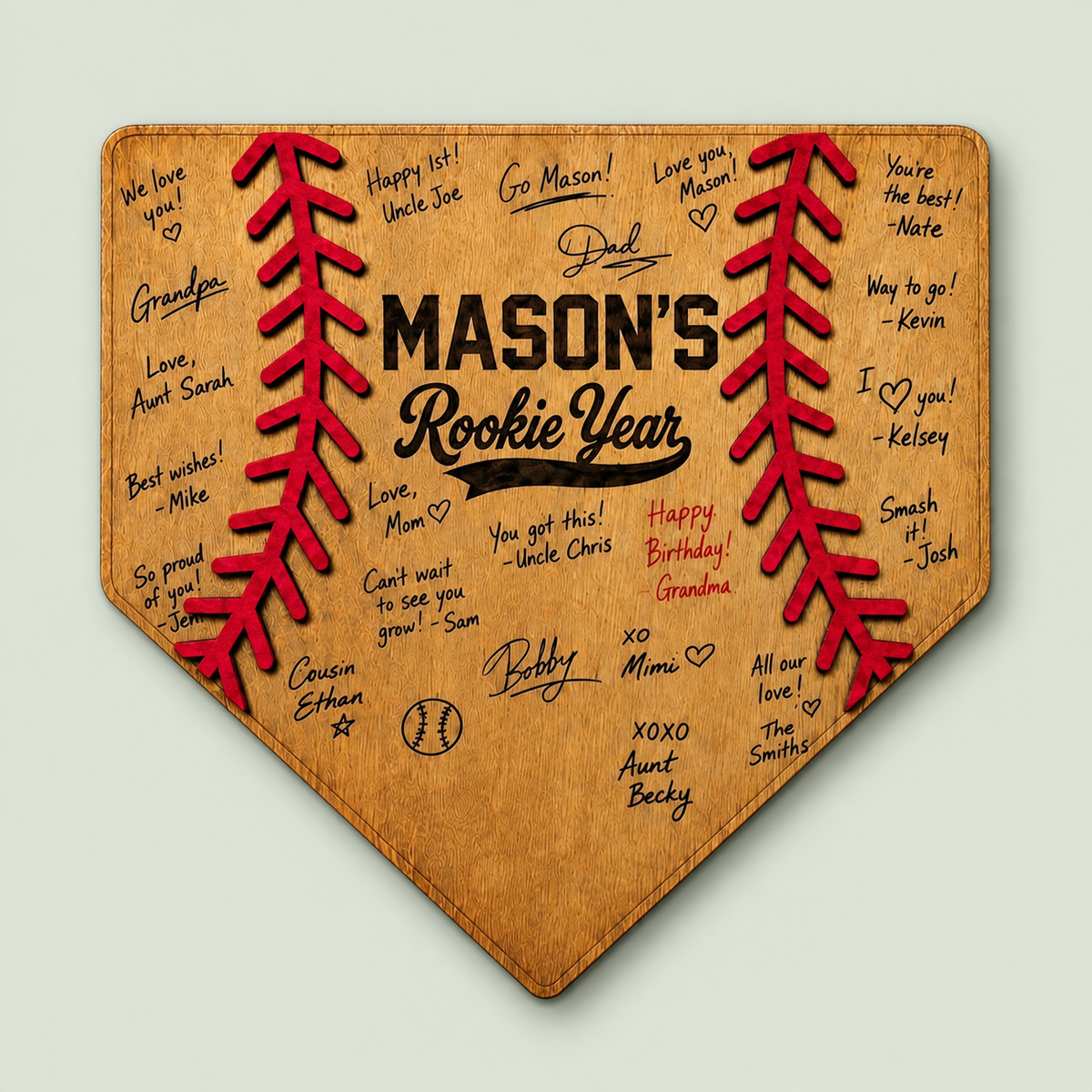 Wooden home plate guest book for a rookie year first birthday baseball party on soft sage.