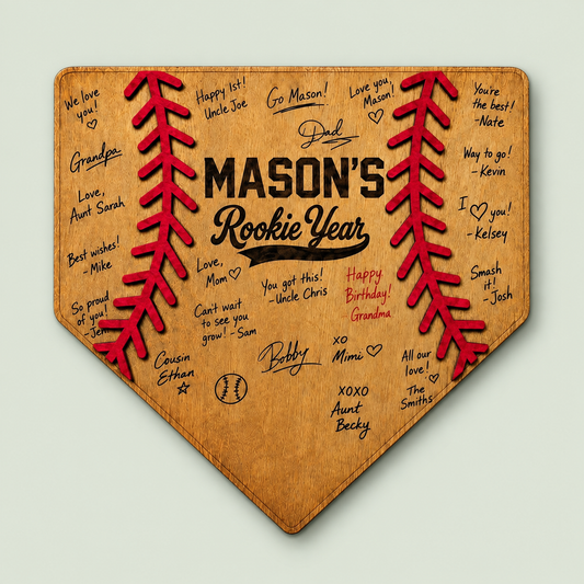 Wooden home plate guest book for a rookie year first birthday baseball party on soft sage.